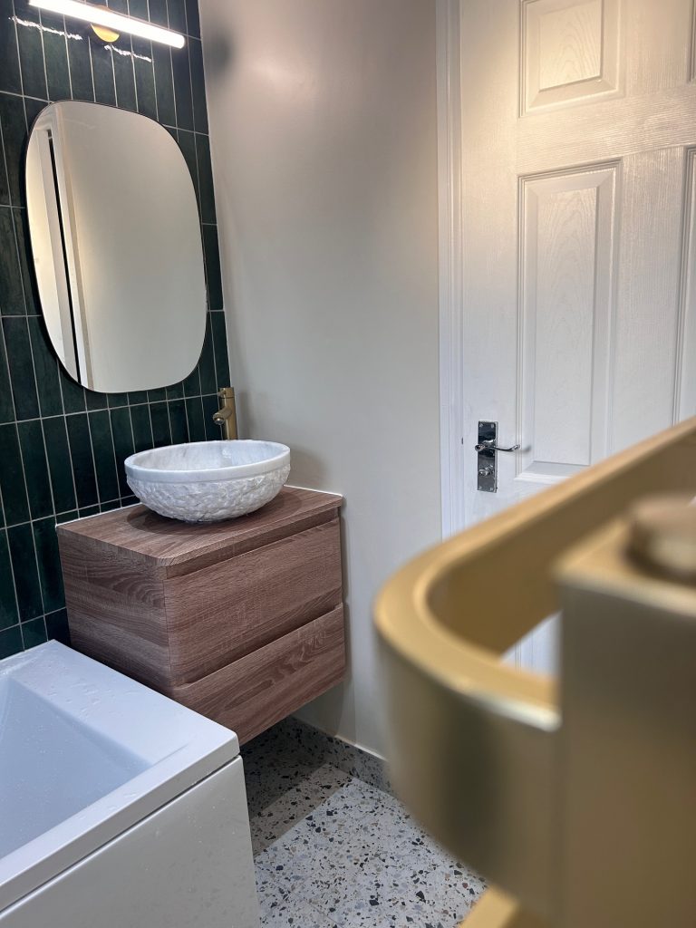 img src="bathroom sink unit.jpg" alt="A stylish brown basin unit">